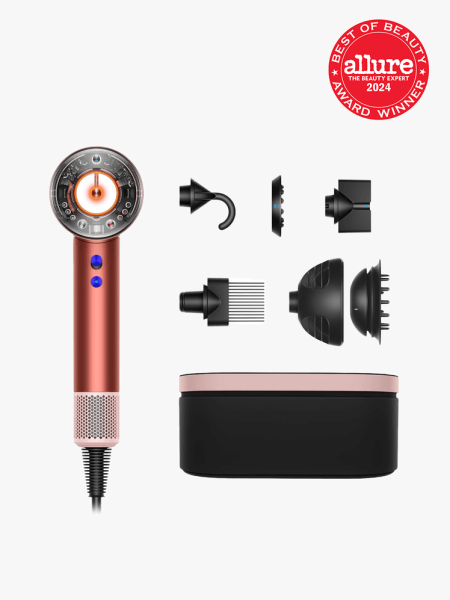 Dyson Supersonic Nural Hair Dryer in branded components on a light gray background with best of beauty 2024 seal in the top right corner